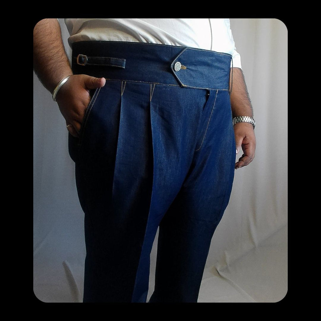Person wearing Denim gurkha pants with a white background