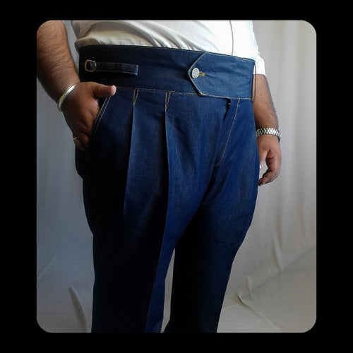 Person wearing Denim gurkha pants with a white background